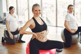 Pregnant woman on exercise ball